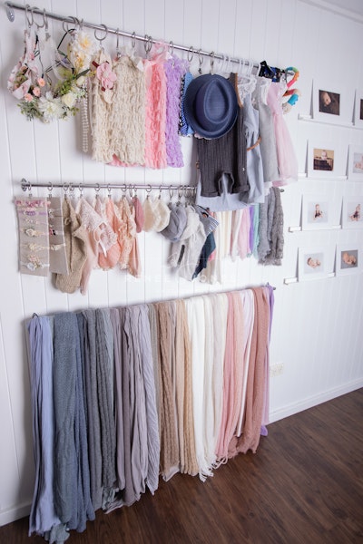 Baby Wraps, Outfits and Headbands - A display of wraps, outfits and headbands for use during photography sessions.