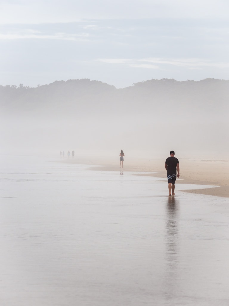 Byron Bay - Figures in the Mist - Early morning beach walkers move through sea mist at Suffolk Park beach, near Byron Bay.