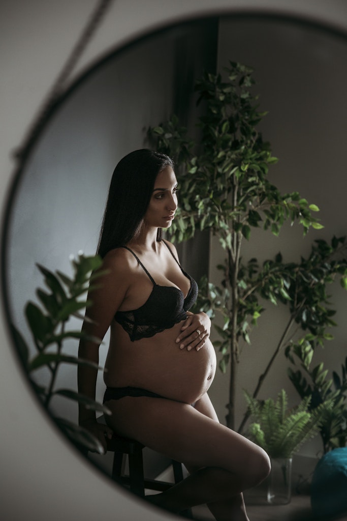 Boudoir Photographer Wollongong 5 - Pregnancy, maternity boudoir shoot. Black lingerie sitting amongst plants mirror reflection. Studio shoot.
Boudoir...